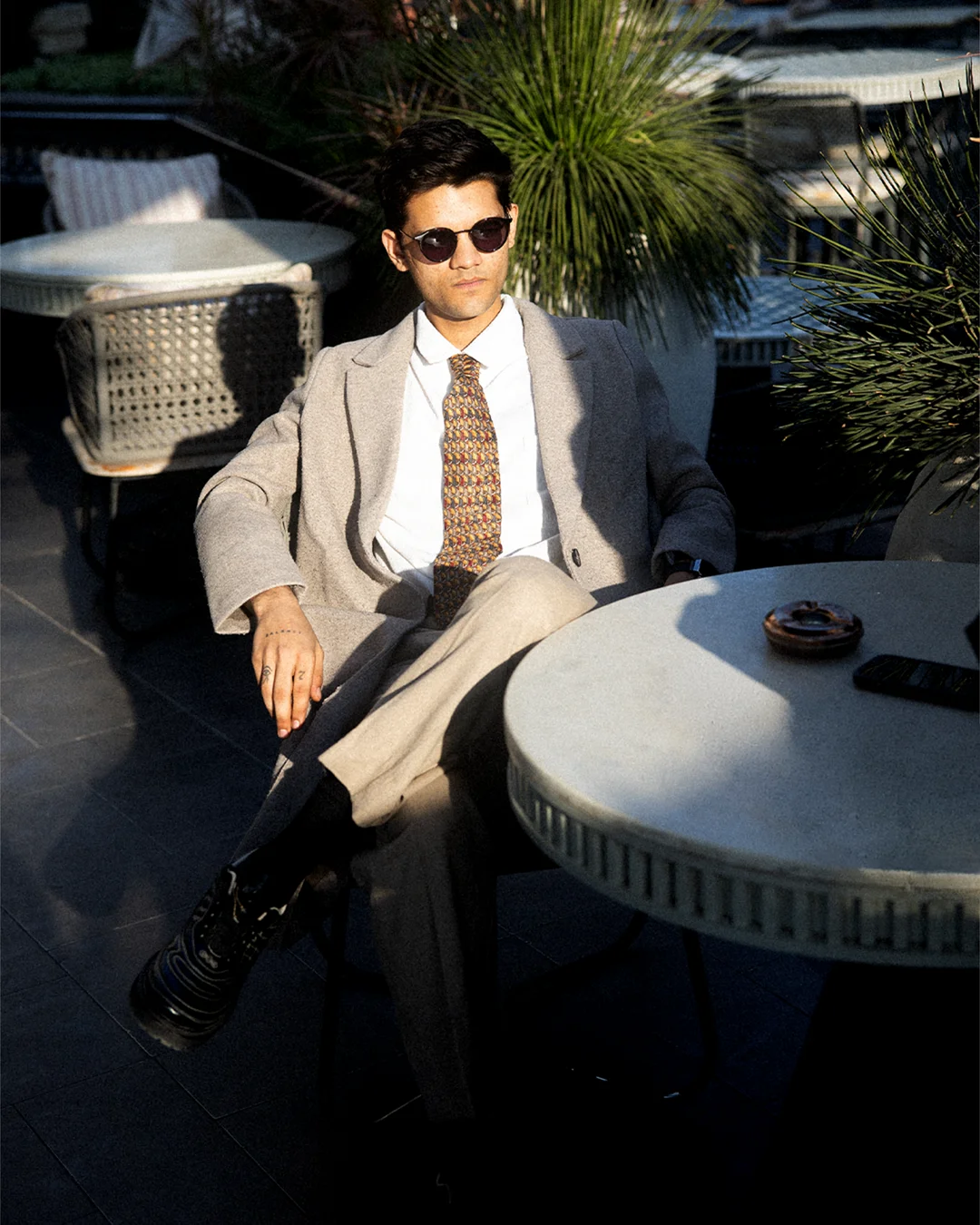 Editorial model wearing a Baiga collection pair, styled as a quiet portrait of the men&rsquo;s collection.