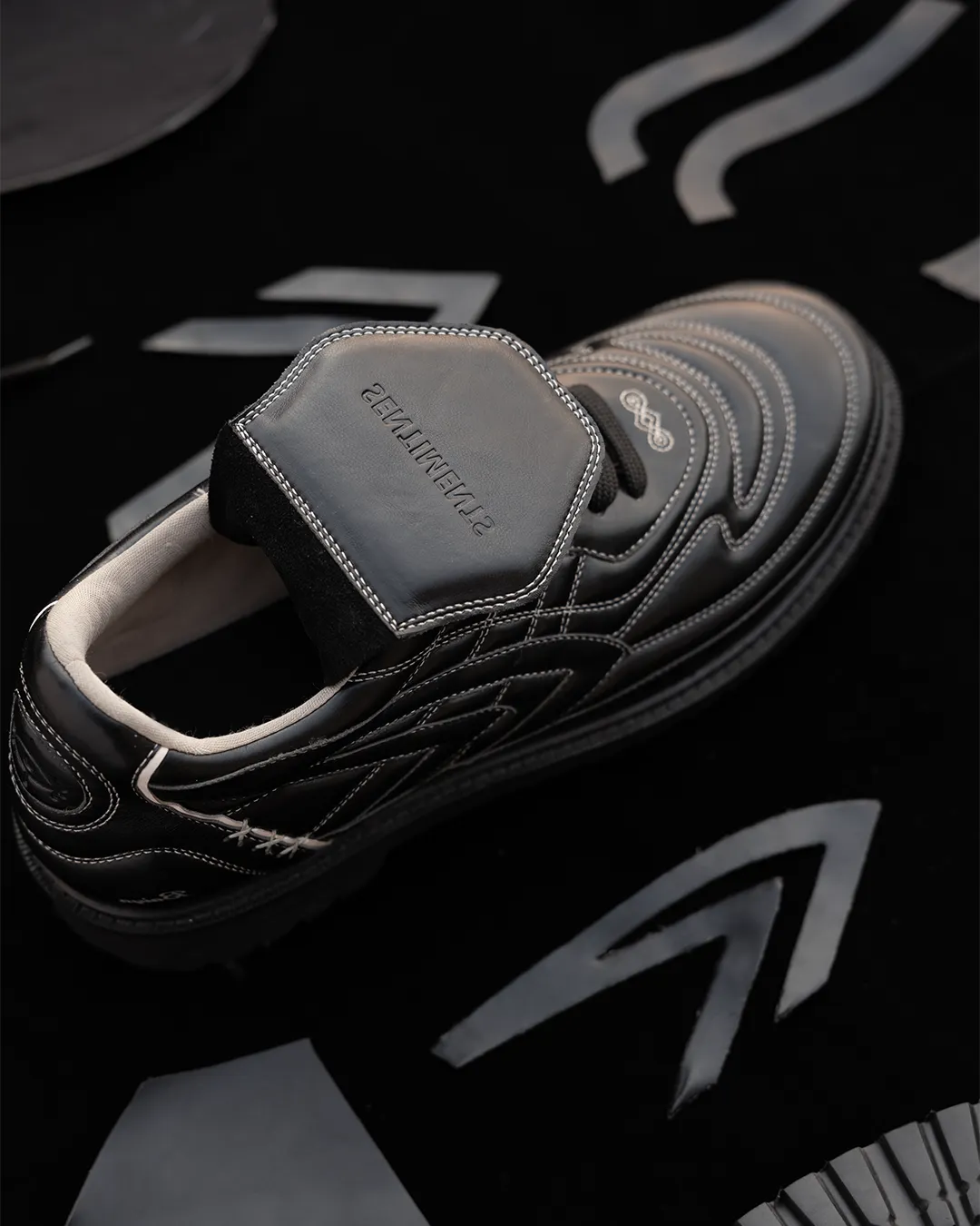 Sentiments shoe components laid out — heel, vamp, sole, insole, eyelets — showing every piece that makes a finished pair.