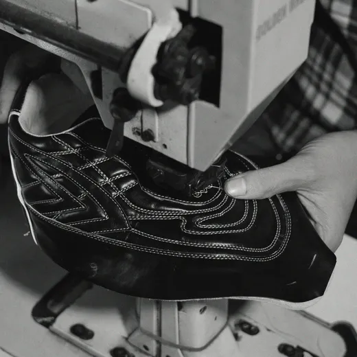 Sentiments craft step 3 — artisan hands assembling a finished pair.