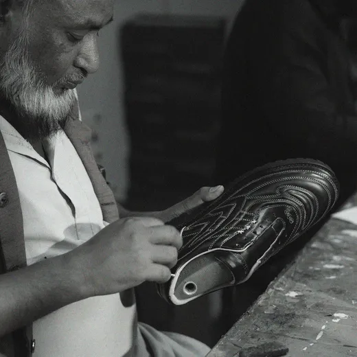 Sentiments craft step 7 — artisan hands assembling a finished pair.