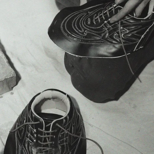Sentiments craft step 8 — artisan hands assembling a finished pair.